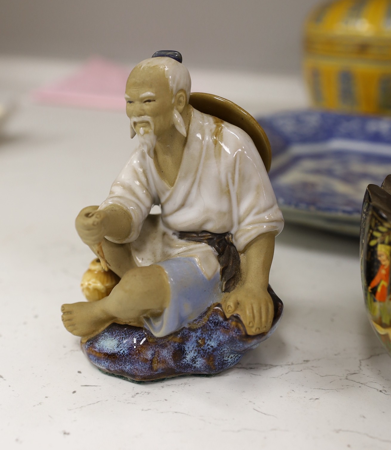 A collection of mostly Chinese ceramics, to include a vase, a lion dog, pestle and mortar etc.